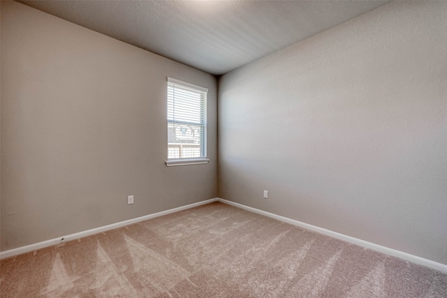 empty room with carpet flooring