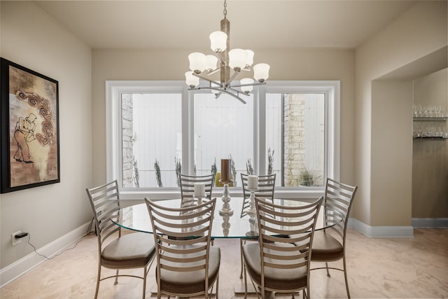 dining room with a notable chandelier