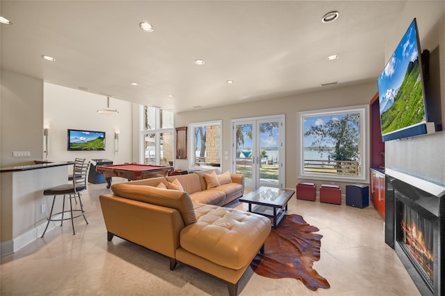 living room featuring french doors and billiards