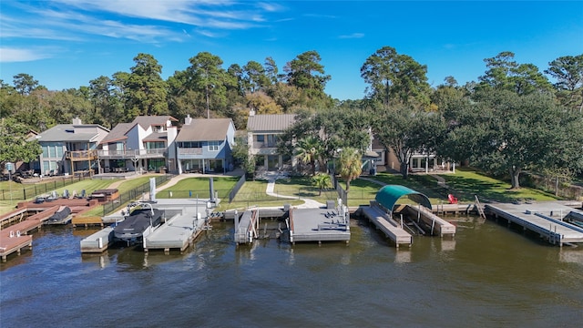 dock area featuring a water view and a yard