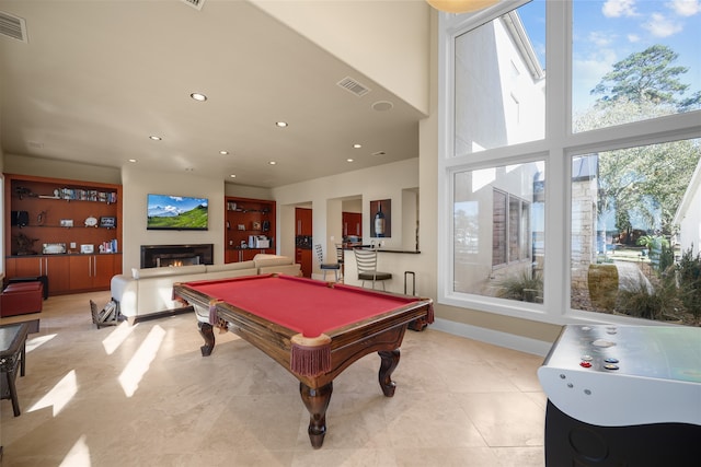 playroom featuring a towering ceiling and pool table