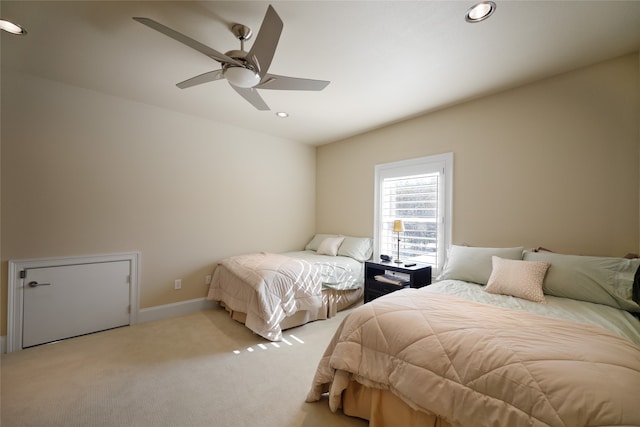 carpeted bedroom featuring ceiling fan