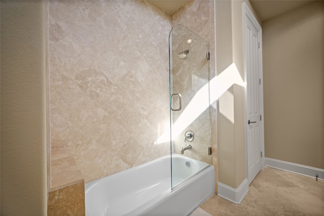 bathroom with tile patterned floors and enclosed tub / shower combo