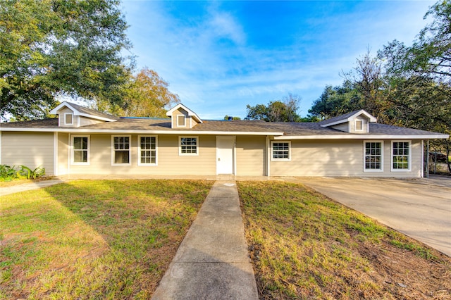 ranch-style home with a front yard