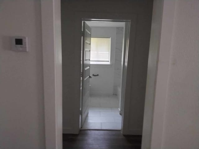 hallway featuring dark hardwood / wood-style floors