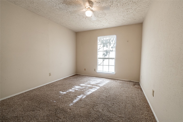 empty room featuring carpet floors and a textured ceiling