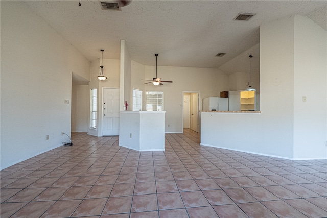 interior space with a textured ceiling, high vaulted ceiling, ceiling fan, and light tile patterned flooring