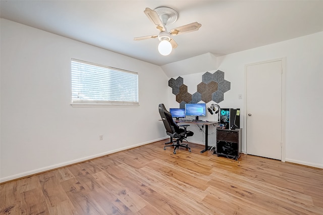 office space with ceiling fan, lofted ceiling, and light wood-type flooring