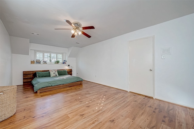 bedroom with ceiling fan and light hardwood / wood-style floors