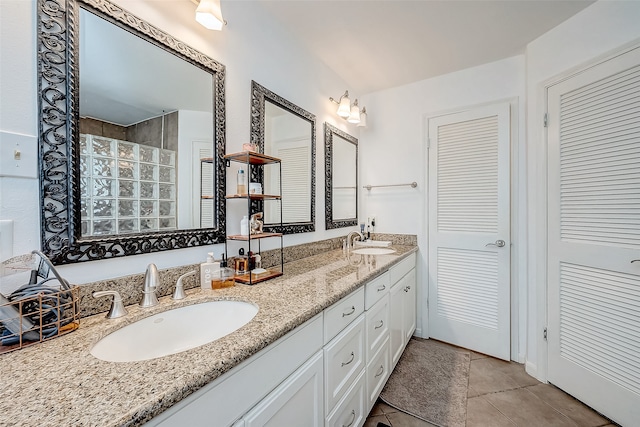 bathroom with tile patterned flooring and vanity