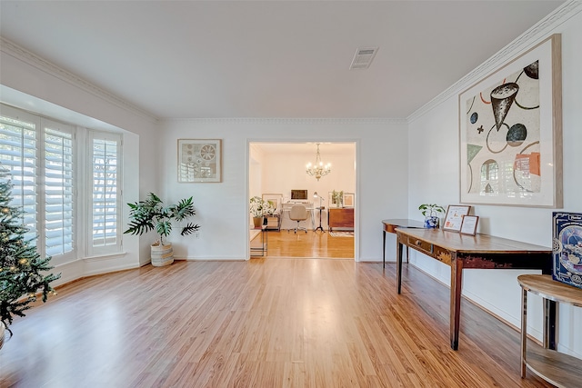 interior space featuring light wood-type flooring, crown molding, and a notable chandelier