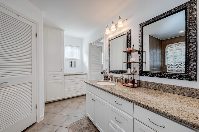 bathroom with tile patterned floors and vanity