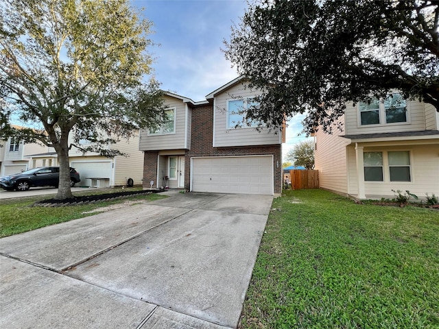 view of front of house with a garage and a front yard