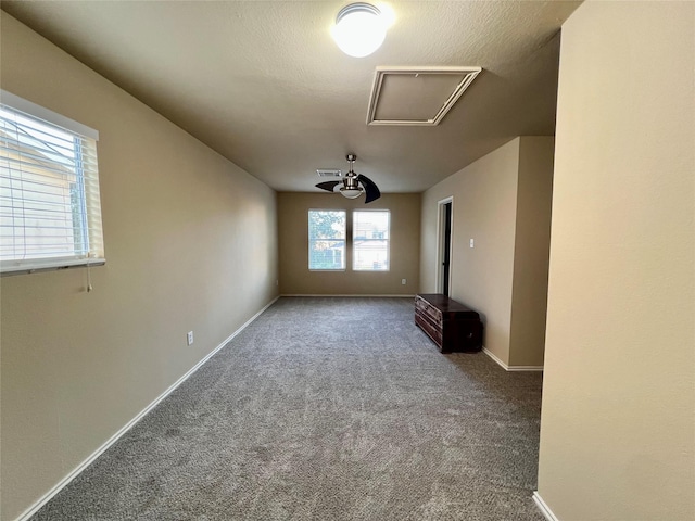 unfurnished living room with carpet flooring, ceiling fan, and a healthy amount of sunlight