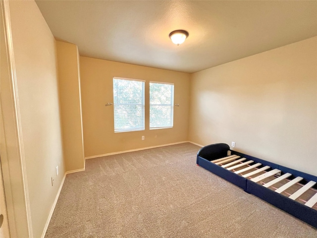 unfurnished bedroom with carpet flooring