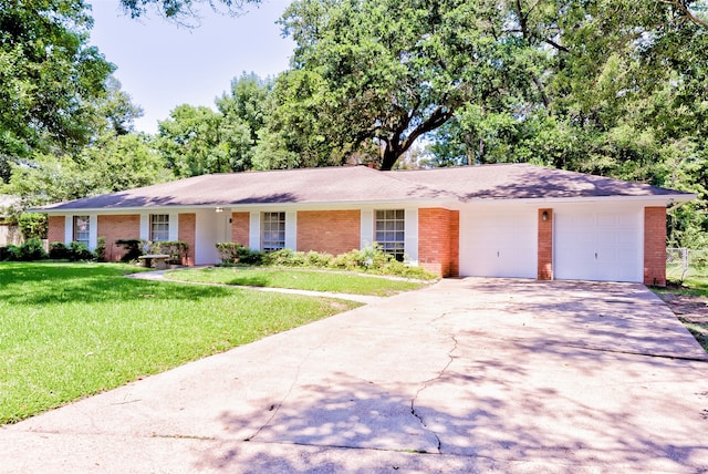 ranch-style house with a front yard and a garage