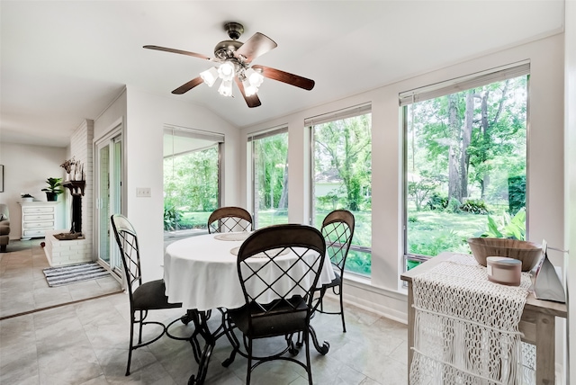 dining area with plenty of natural light, ceiling fan, and vaulted ceiling