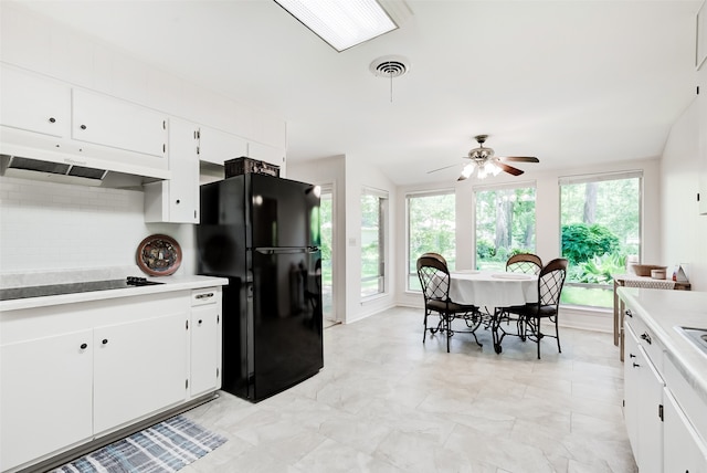 kitchen featuring backsplash, ceiling fan, white cabinets, and black appliances