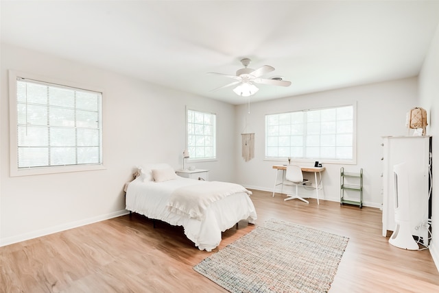 bedroom featuring ceiling fan and light hardwood / wood-style flooring