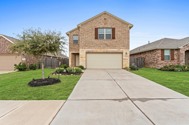 view of front property featuring a garage and a front lawn