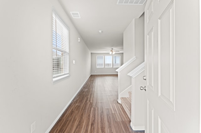 hall with wood-type flooring