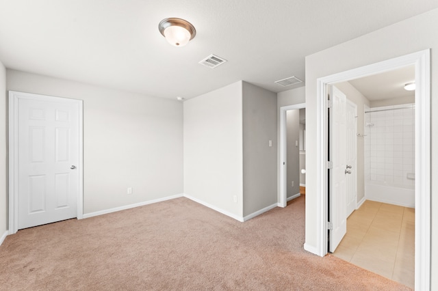 empty room featuring light colored carpet