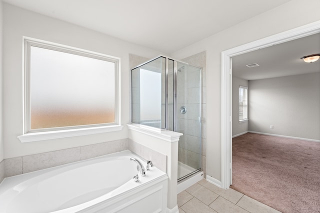 bathroom featuring tile patterned flooring and plus walk in shower