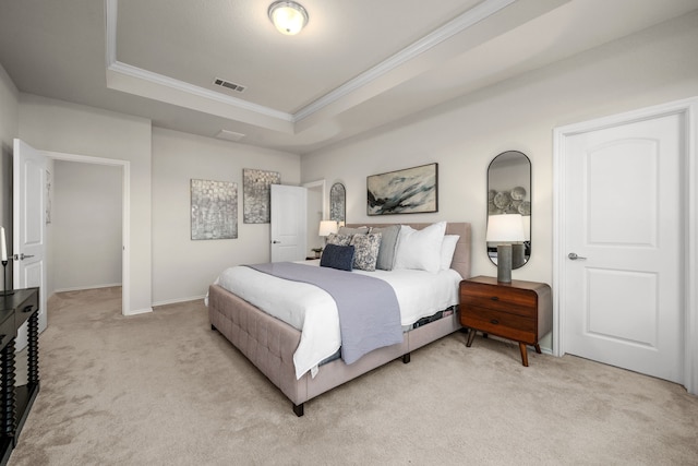 carpeted bedroom with a raised ceiling and ornamental molding