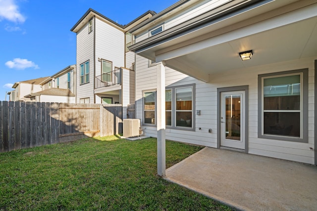 view of yard featuring central AC and a patio area