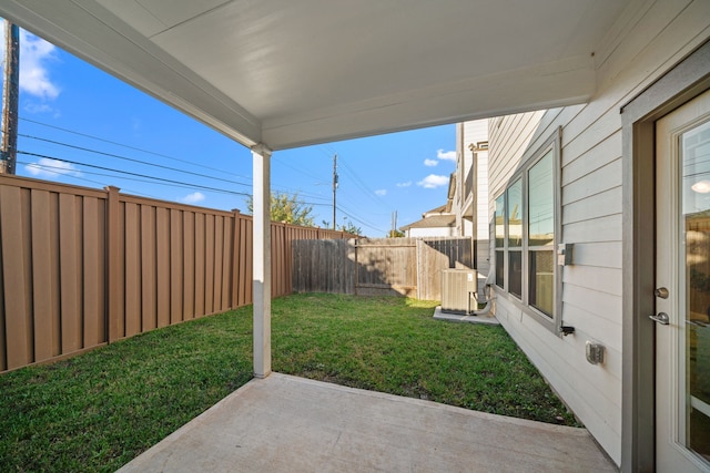 view of yard featuring a patio and central AC