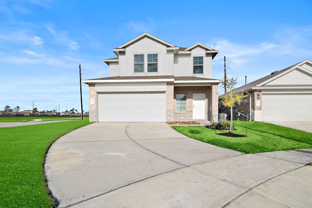 front facade featuring a front yard and a garage