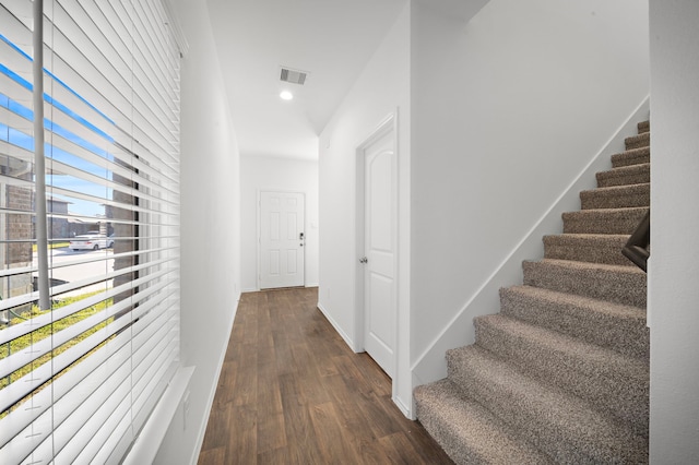 hall with dark hardwood / wood-style floors