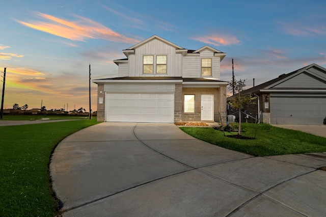 view of front of house with a lawn and a garage