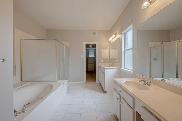 bathroom featuring tile patterned floors, vanity, and shower with separate bathtub