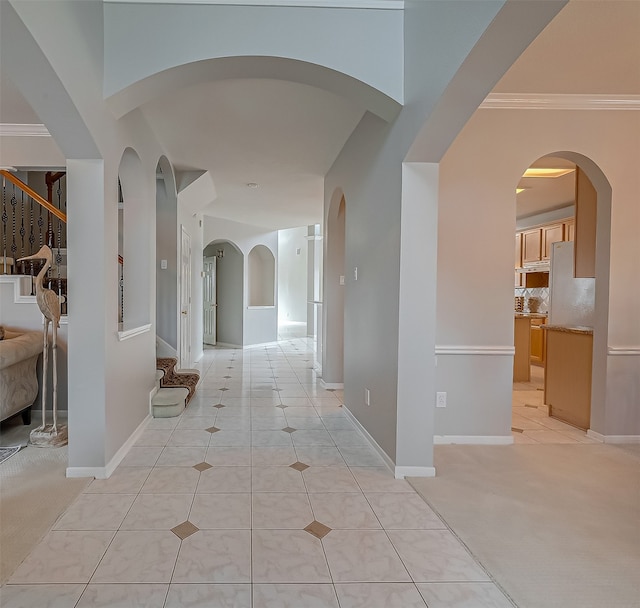 corridor with light colored carpet and ornamental molding