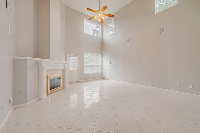 2519 Meadow Tree Ln, Spring, TX 77388 - unfurnished living room with high vaulted ceiling, ceiling fan, a fireplace, and light tile patterned flooring