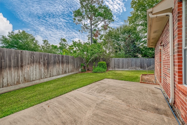 exterior space featuring a lawn and a patio area