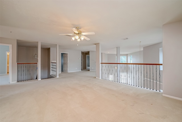 carpeted empty room with ceiling fan