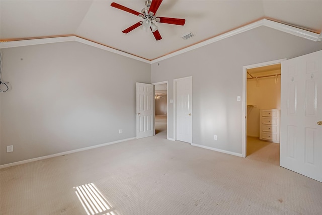 2519 Meadow Tree Ln, Spring, TX 77388 - unfurnished bedroom with vaulted ceiling, a walk in closet, carpet, a ceiling fan, and a closet
