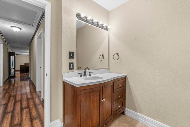 bathroom featuring vanity and wood-type flooring