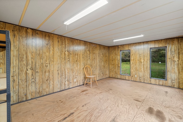 spare room with wooden walls