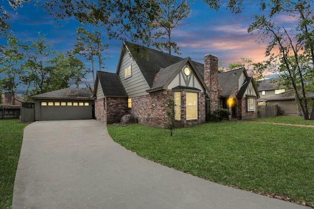 view of front of property featuring a lawn and a garage