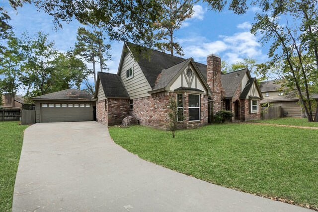 view of front of house with a front yard and a garage