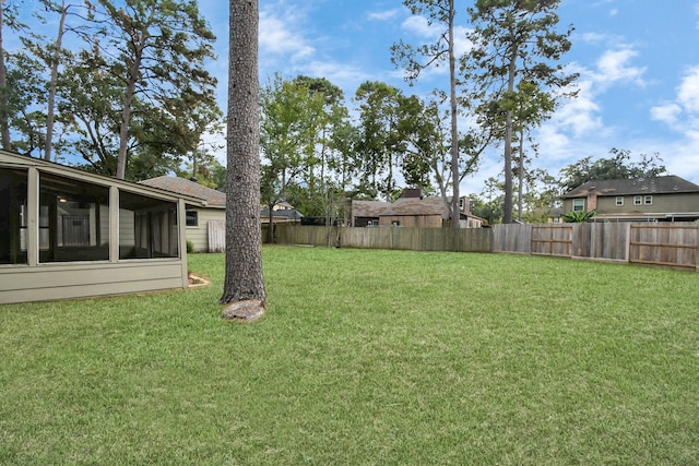 view of yard featuring a sunroom