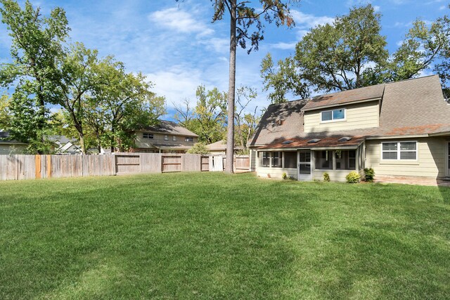 view of yard with a sunroom