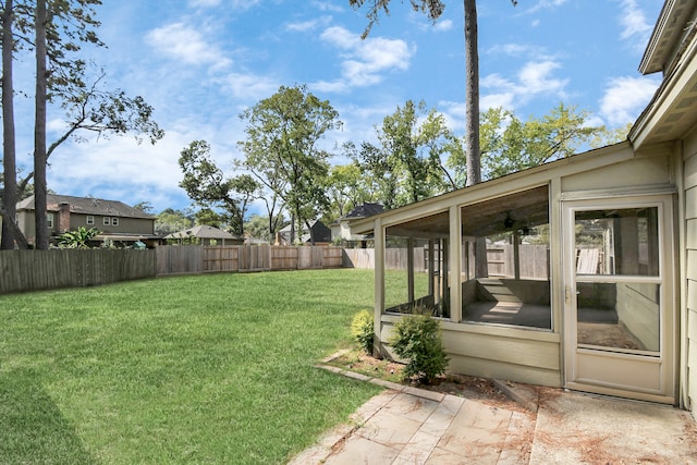 view of yard featuring a sunroom