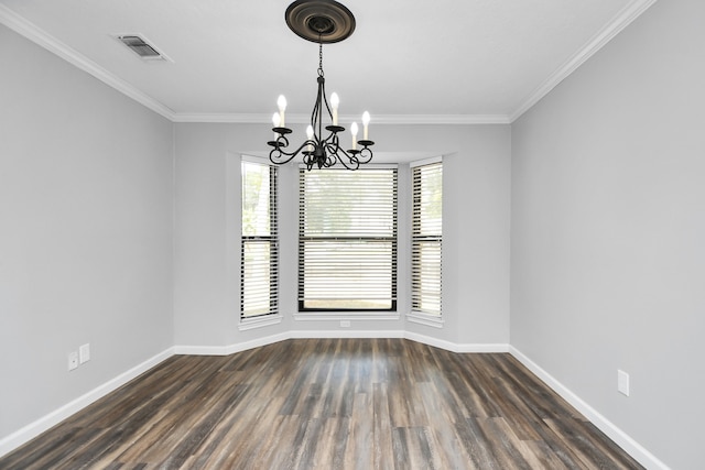 unfurnished room featuring a chandelier, dark hardwood / wood-style floors, and ornamental molding