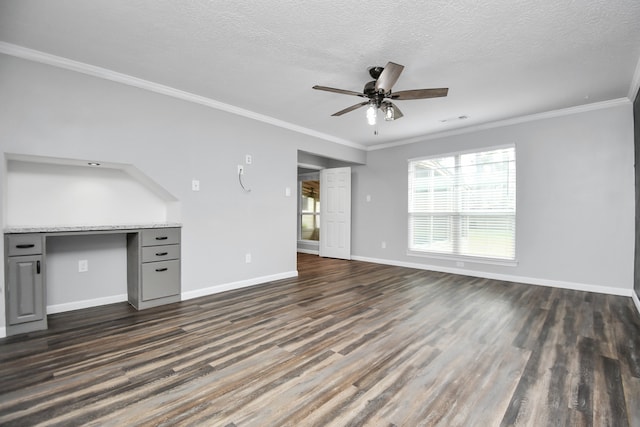 unfurnished living room featuring a textured ceiling, dark hardwood / wood-style flooring, ceiling fan, and ornamental molding