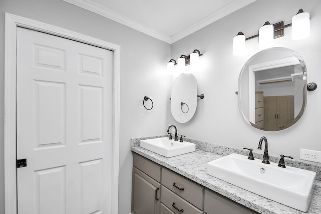 bathroom featuring vanity and ornamental molding