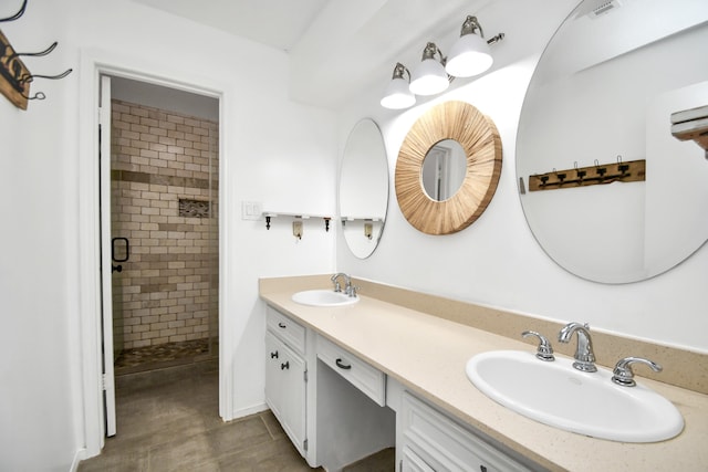 bathroom featuring vanity and an enclosed shower